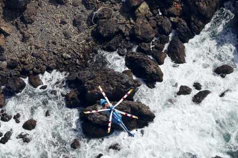 emergency services rescue an unconscious child from the ice – cold sea – •