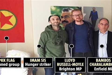 Labour MPs snapped in damning photo posing by flag of banned terror group responsible for killing..