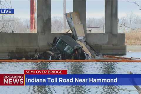 UPS Semi-truck goes off bridge, catches fire on Indiana Toll Road in Hammond