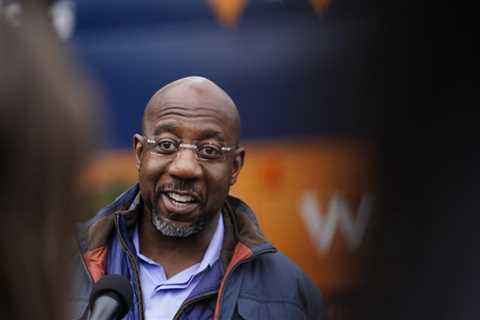 AP: Raphael Warnock defeats Herschel Walker