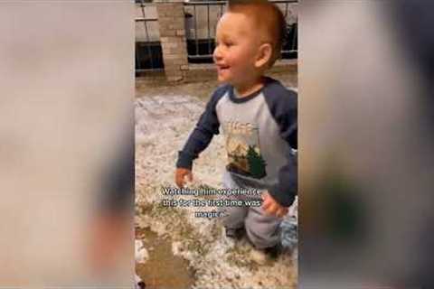 Adorable moment little boy sees snow for the first time