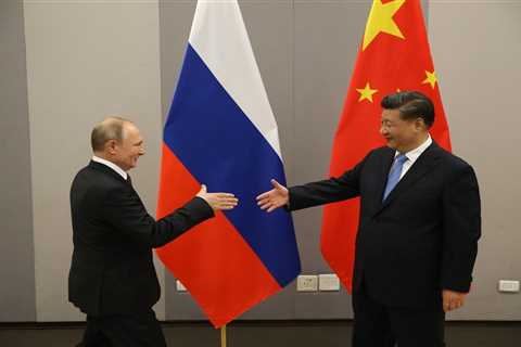 Russia is smashing open its $45 billion piggy bank of Chinese yuan as energy revenue crashes