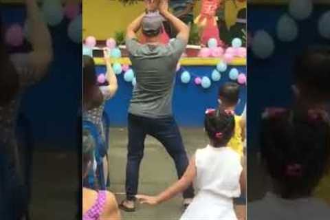 Supportive father dances with daughter