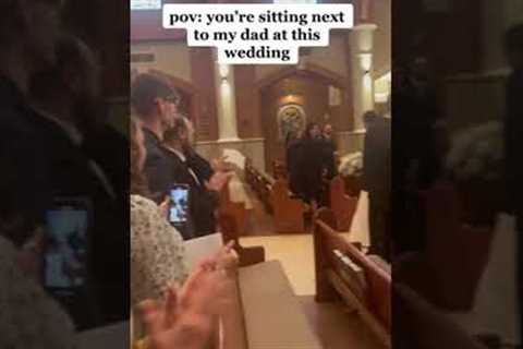 Sneaky dad pretends to photograph newlywed couple