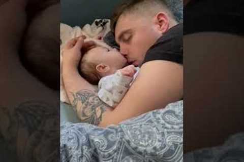 Sleeping baby girl tries to eat dads nose