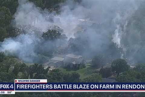 Irving firefighters battle apartment fire in summer heat