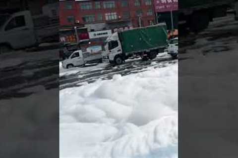 Detergent factory overflows creating snowy streetscape