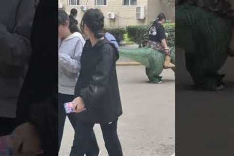 Students in T-Rex suits terrify children on campus