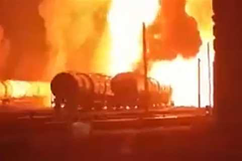 Dramatic moment fuel tanker explosion triggers massive inferno at train station in Russia-occupied..