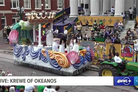 Queen of Krewe of Okeanos and her maids toast at Gallier Hall