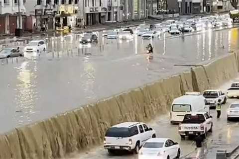 Watch moment cars are swept away & roads become raging rivers as floods swamp Saudi Arabia as..