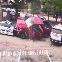 WATCH: Truck rams into Dallas police vehicle, nearly driving over it