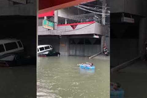 Man Enjoys Flooded City Streets In Quezon City