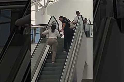 Clueless Women Climb Up The Down Escalator